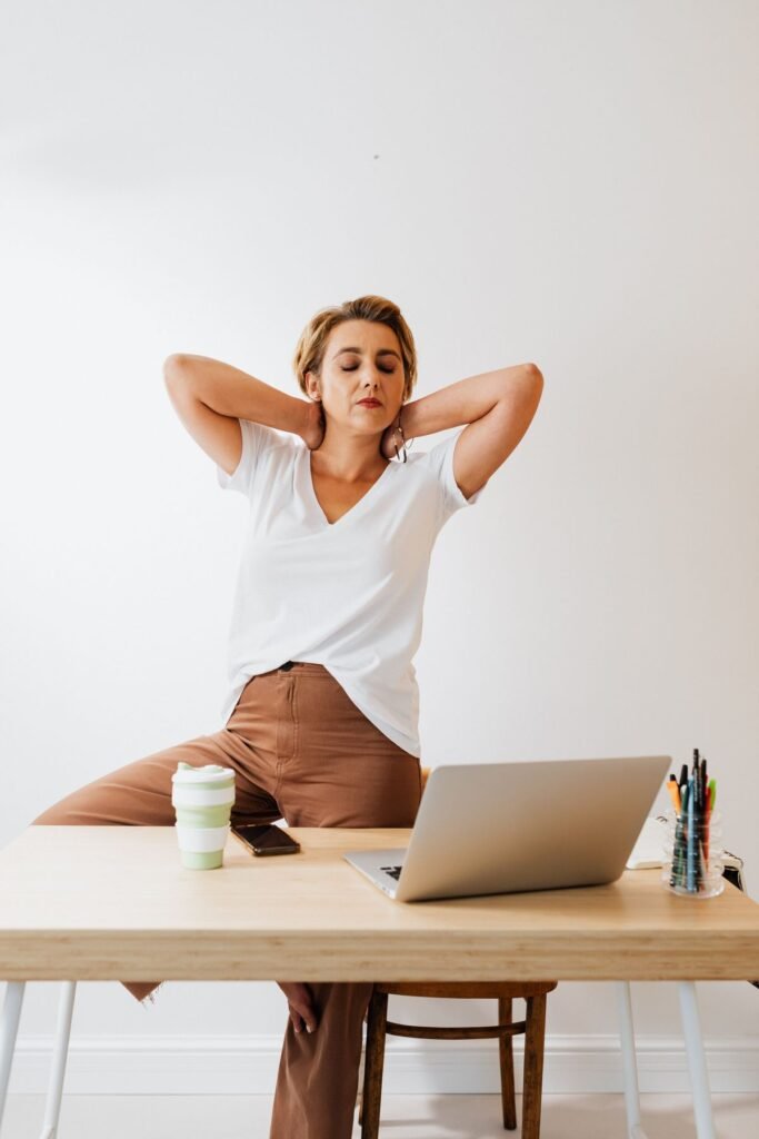 Gentle neck stretch for desk workers at an office desk